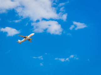 Airplane in the blue sky. Departure from Ibiza airport