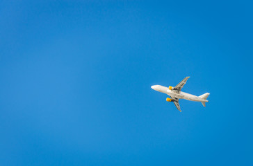 Airplane in the blue sky. Departure from Ibiza airport