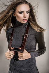 Beautiful model in fashion clothes in studio