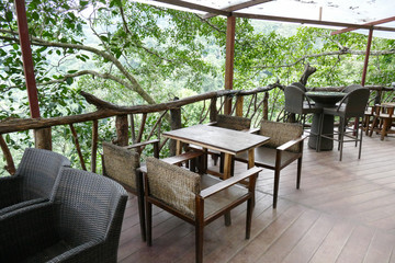 Fototapeta na wymiar rattan and wooden chair and desk on the terrace