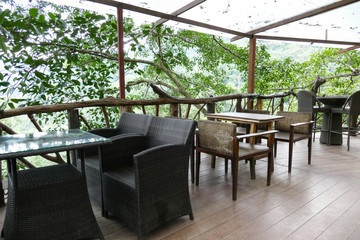 rattan and wooden chair and desk on the terrace