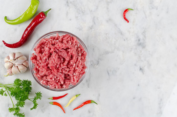 Raw ground beef and ingredients