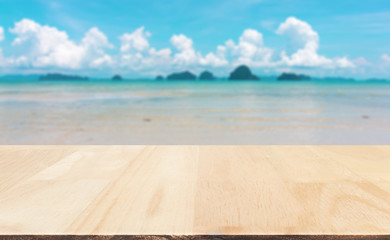 Wood table top on blured sea and sky : Can use for montage or display your product.