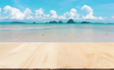 Fototapeta premium Wood table top on blured sea and sky : Can use for montage or display your product.