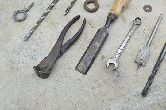 Assorted old work tools on wooden