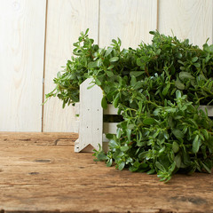 bunch of fresh portulaca sativa on wooden table
