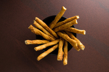pastry sticks with cheese in a bowl