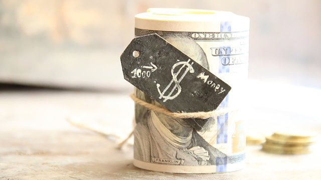 One roll from dollars and a tag with a dollar sign