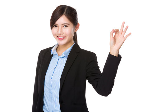 Asian young businesswoman with ok sign gesture