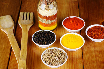variety of spices at wood background 