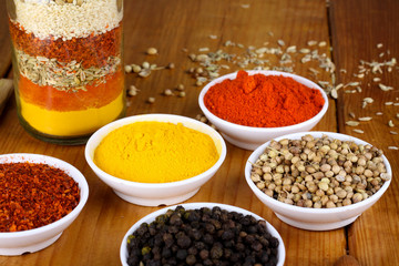 variety of spices at wood background 