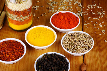 variety of spices at wood background 