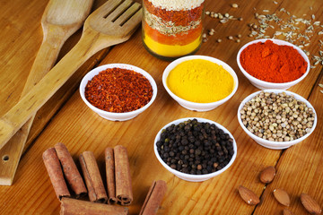 variety of spices at wood background 