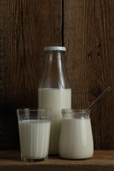 Glass of milk products on wooden background