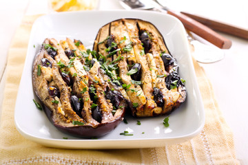 Eggplant with feta cheese and black grapes