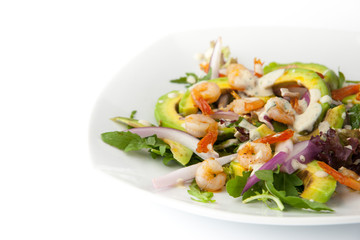 Salad with avocado and shrimp on the white background horizontal