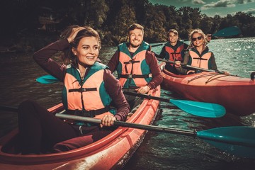 Group of happy people on a kayaks © Nejron Photo