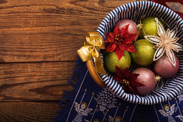Basket with Christmas accessories on wooden background. Top view