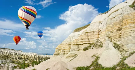 Fotobehang Hot air balloons flying over Love valley at Cappadocia, Turkey © olenatur