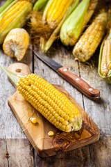 organic sweet corn on cutting board