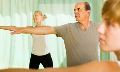 Elderly couple with trainer