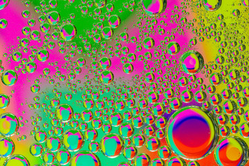 abstract macro of oil mixed with water on colorful