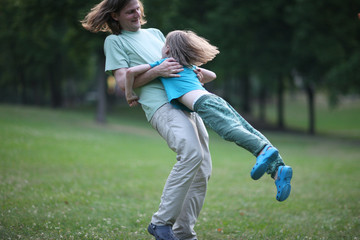 Happy father playing with a son