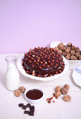 Delicious chocolate cakes with hazelnut on table