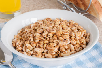 Puffed wheat breakfast cereal
