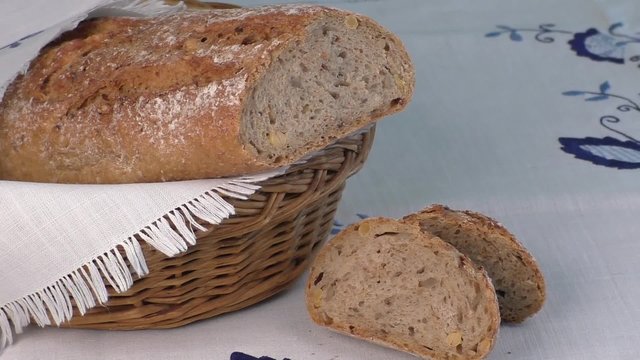 Rustic bread in the bakery basket with napkin 
