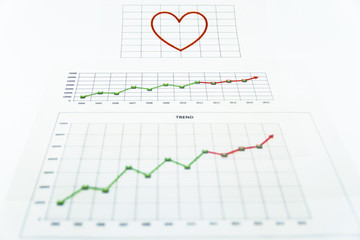 stack of paper documents with financial reports.