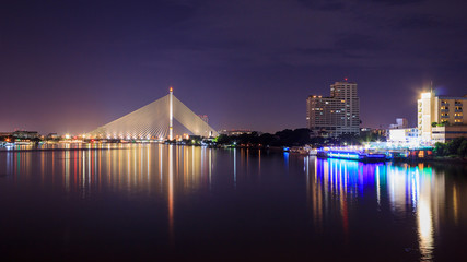 Crossing river bridge in night
