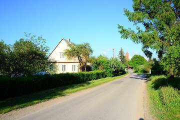 Fototapeta na wymiar Road to the church in Viesintos town in Anyksciai district