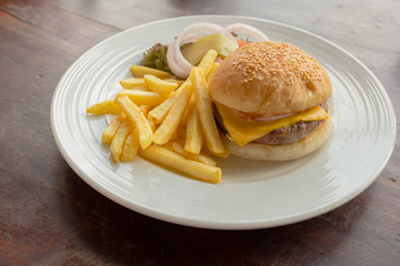 Cheese burger with french fries on the table