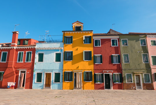Typical brightly colored houses of Burano, Venice lagoon, Italy. © isaac74