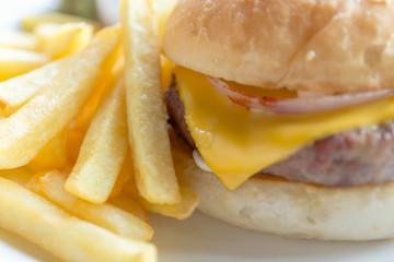 Cheese burger with french fries on the table