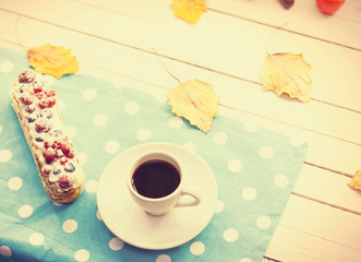 Eclair and cup of coffee