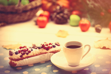 Eclair and cup of coffee
