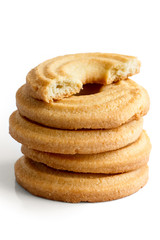 Stack of butter ring biscuits isolated on white in perspective.