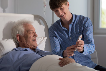 Relatives looking at smartphone