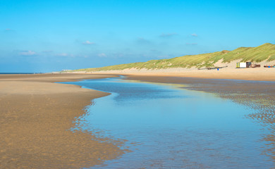 Blue sky over a beach along the North Sea