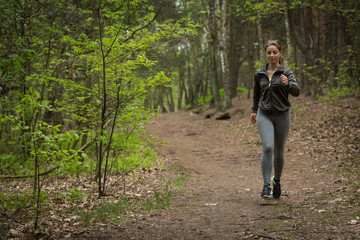 Pretty sportswoman jogging