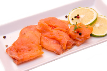 Smoked salmon on tray on white background seen close
