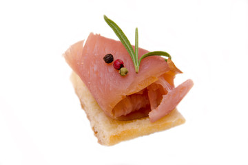 Smoked tuna on toast on white background