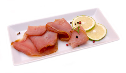 Smoked tuna on the tray on white background