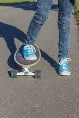 Skateboard / Girl with blue shoes on a skateboard 