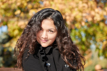 woman portrait in city park in fall season