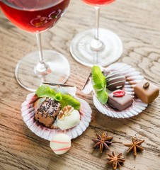 Luxury chocolate candies with two glasses of wine