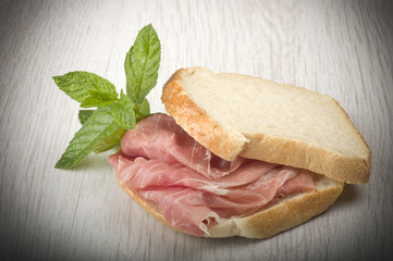 sandwich with Italian prosciutto crudo ,raw ham leg sliced