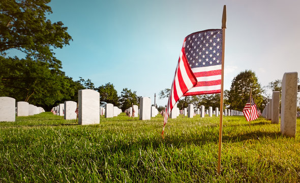 Washington DC Arlington National Cemetery On Memorial Day. Ground Level Perspective With Flag.